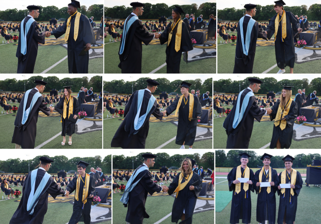 students receiving diplomas and shaking mans hand